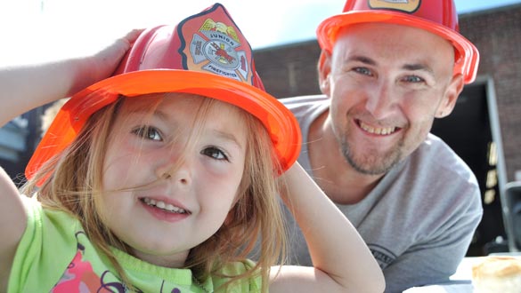 Four-year-old Baileigh Jarosch and her dad Dan sport some plastic fire helmets at the Recruit NY event held at the New Paltz Firehouse this past Saturday. (photo by Lauren Thomas)
