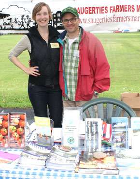 Market manager Ayla Rector with last year’s co manager, Kevin Dumont. (photo by David Gordon)