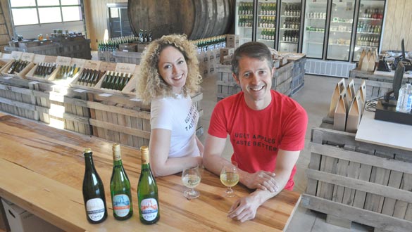 Lindsey Storm, Mikel Martiararena and a selection of beverages from Brooklyn Cider House are pictured in the new tasting room and farm stand at Twin Star Orchards at 155 North Ohioville Road in New Paltz. (photo by Lauren Thomas)