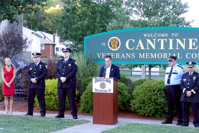 Assemblyman Pete Lopez, center, addresses the assembled company. From left to right are Bridget Lopez, captain Stephen Filak, pastor Christopher Berean, master of ceremonies Brian Martin and police chief Joseph Sinagra.