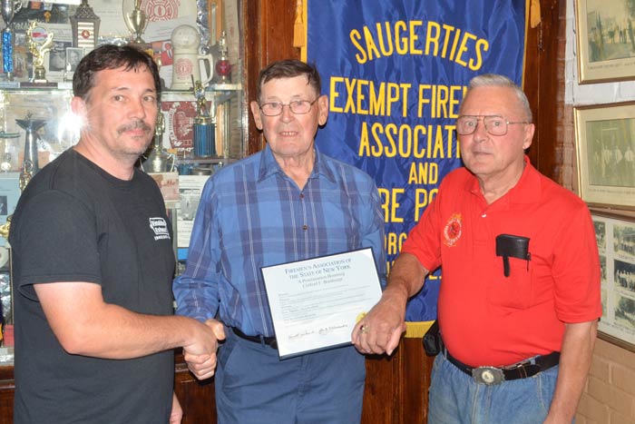 Cliff Breithaupt, center, is honored by Anthony Bell, president of the Saugerties Exempt Firemen’s Association and Michael Cesaser of the Hudson Valley Volunteer Firemen’s Association for 60 years of service. (photo by Robert Ford)