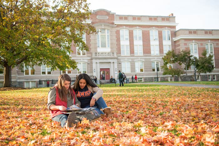 Students may feel too mature to jump in leaf piles, but that doesn’t keep them from engaging often in the season’s activities, as seen here in SUNY New Paltz’s old main quad. (photo courtesy of SUNY New Paltz)