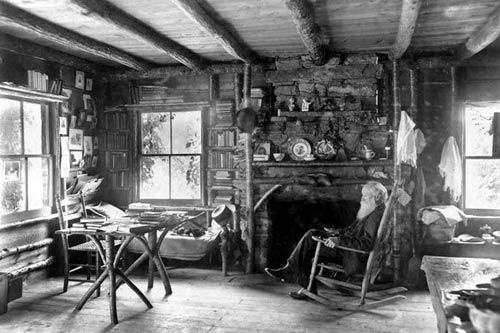 Slabsides in West Park is the name of the cabin that John Burroughs built in 1895. It was in this building that Burroughs (shown above) wrote some of the essays that made him America’s foremost nature writer of his time, as well as entertaining such callers as Theodore Roosevelt, John Muir, Thomas Edison, Walt Whitman and Henry Ford, up until his death in 1921. Designated a National Historic Landmark in 1968, Slabsides is preserved today much as Burroughs left it. Slabs of lumber with their bark still on cover the exterior walls, and the rustic red cedar posts that Burroughs helped set in place still uphold the porch. Inside the cabin, the furniture that Burroughs used (and much of which he made) remains as it was.
