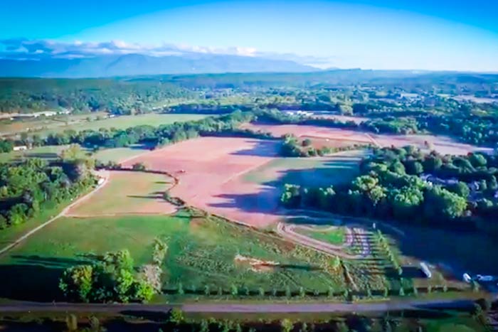Aerial view (above) and view from the ground (below) of the Esopus Agricultural Center. This 214-acre parcel in the Town of Ulster is close to the Thruway, developed residential areas, TechCity and the shopping malls of Route 9W. Formerly known as the Chambers Farm, it was part of a huge land grant awarded to captain Thomas Chambers in recognition of his leadership in freeing the captives taken in the 1663 uprising by the Esopus band of the native Lenape people (an expedition that led to the settling of New Paltz by some of its participants). (photos by Robert Rodriquez)