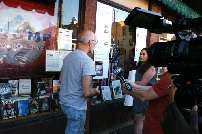 Brian Donoghue and Angie Minew discuss their positions in front of the store. (photos by David Gordon)
