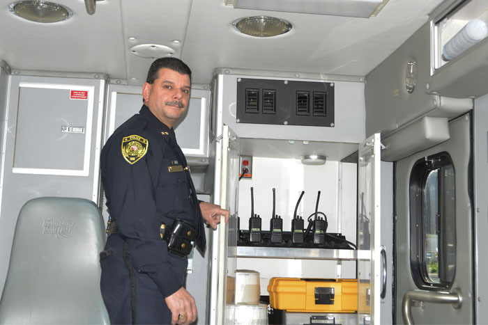 Interior of the police vehicle, with Chief Sinagra.
