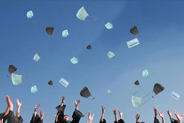 Graduates throw face masks in the air instead of mortarboards